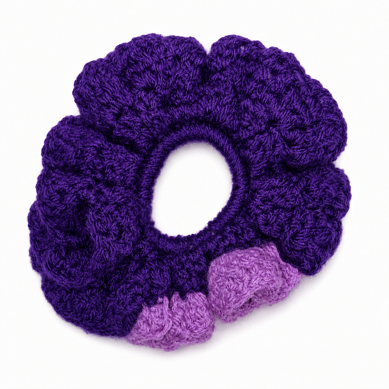 Handmade Jamaican deep purple and lavender crochet scrunchie on a clean white background