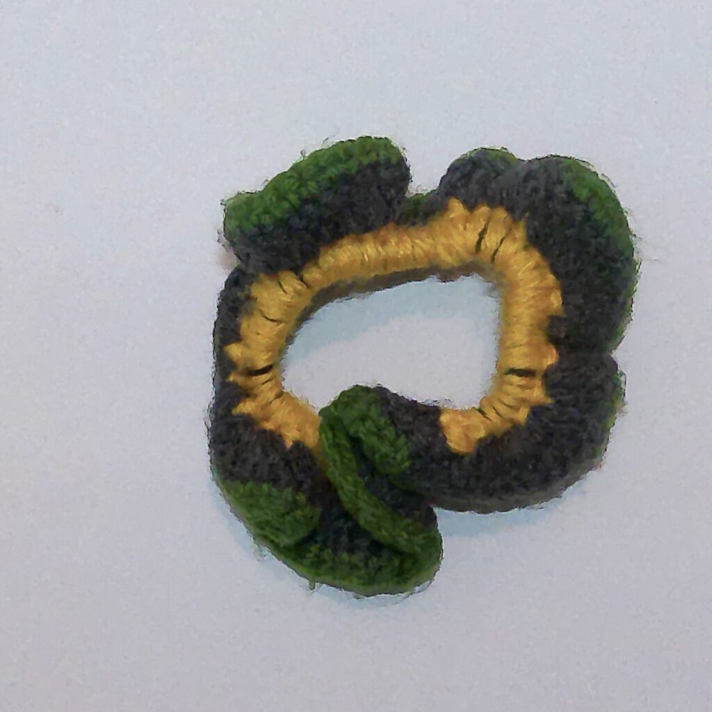 Handmade Jamaican green, charcoal-gray and golden-yellow crochet scrunchie