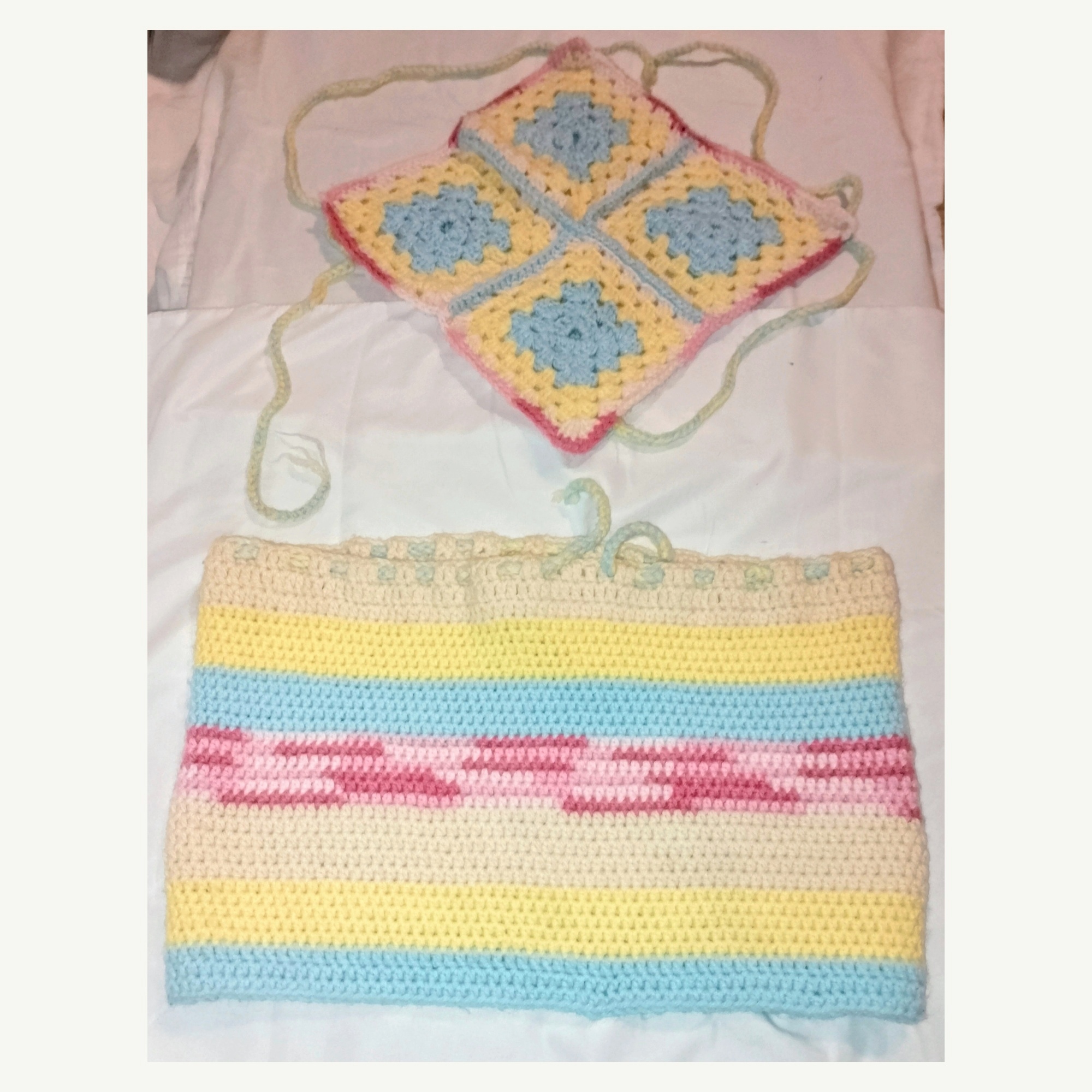 Handmade Jamaican pastel granny-square crochet halter top and striped mini skirt two-piece set flat lay