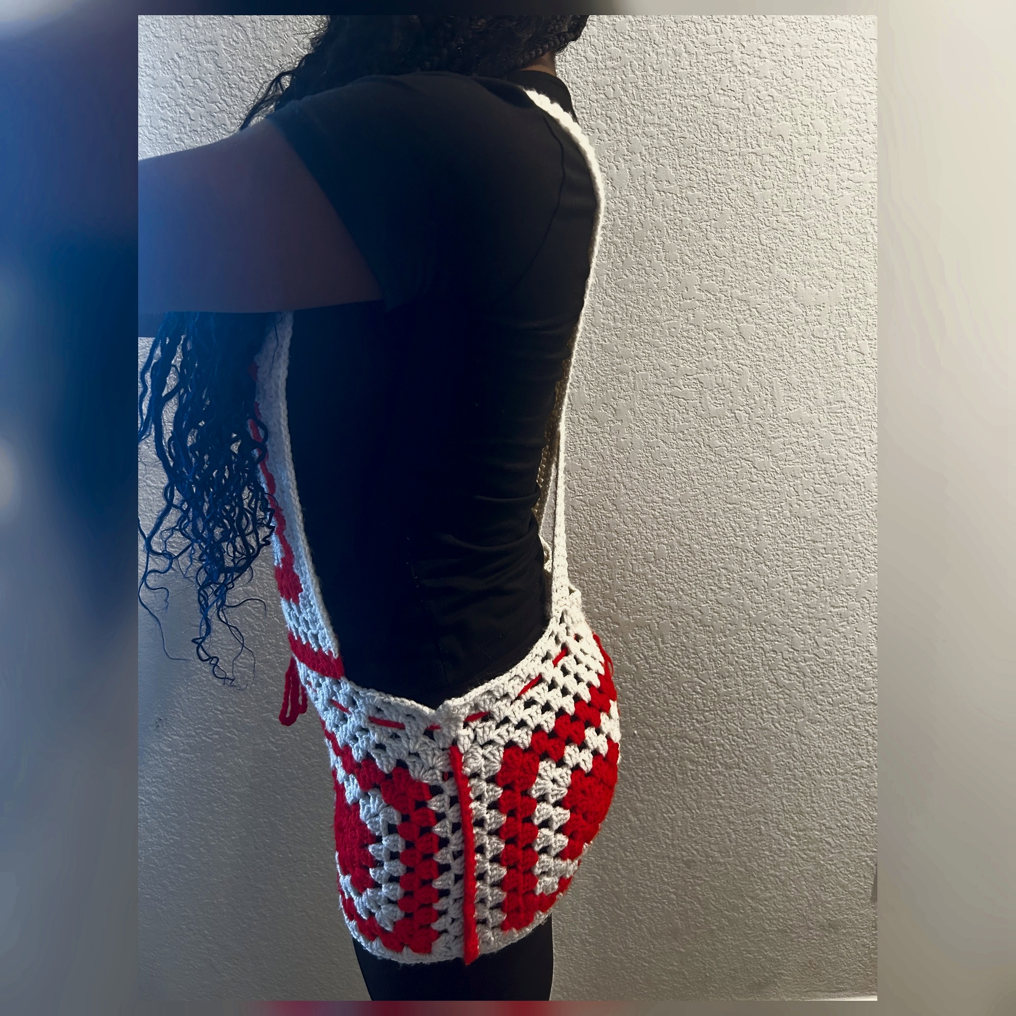 Opposite side view of handmade Jamaican red and cream granny-square crochet skirt romper