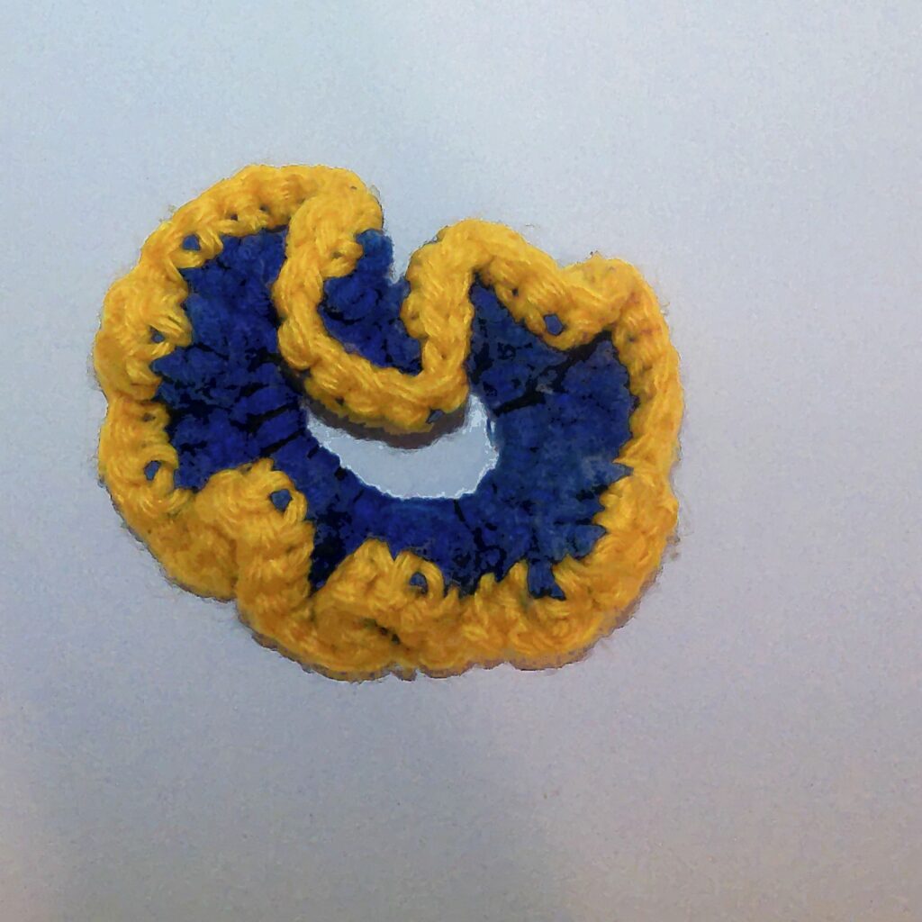 Handmade Jamaican royal-blue and golden-yellow crochet scrunchie