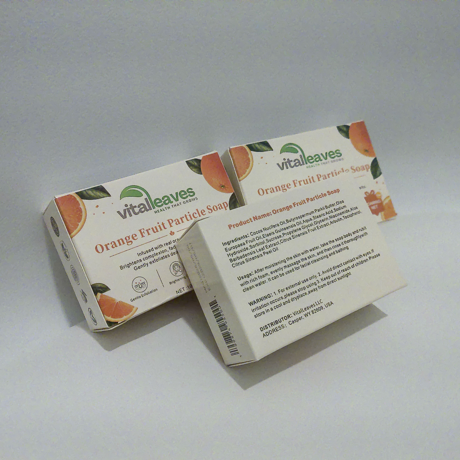 Angled view of three individually packaged VitalLeaves Citrus Glow Orange Fruit Particle Soap bars
