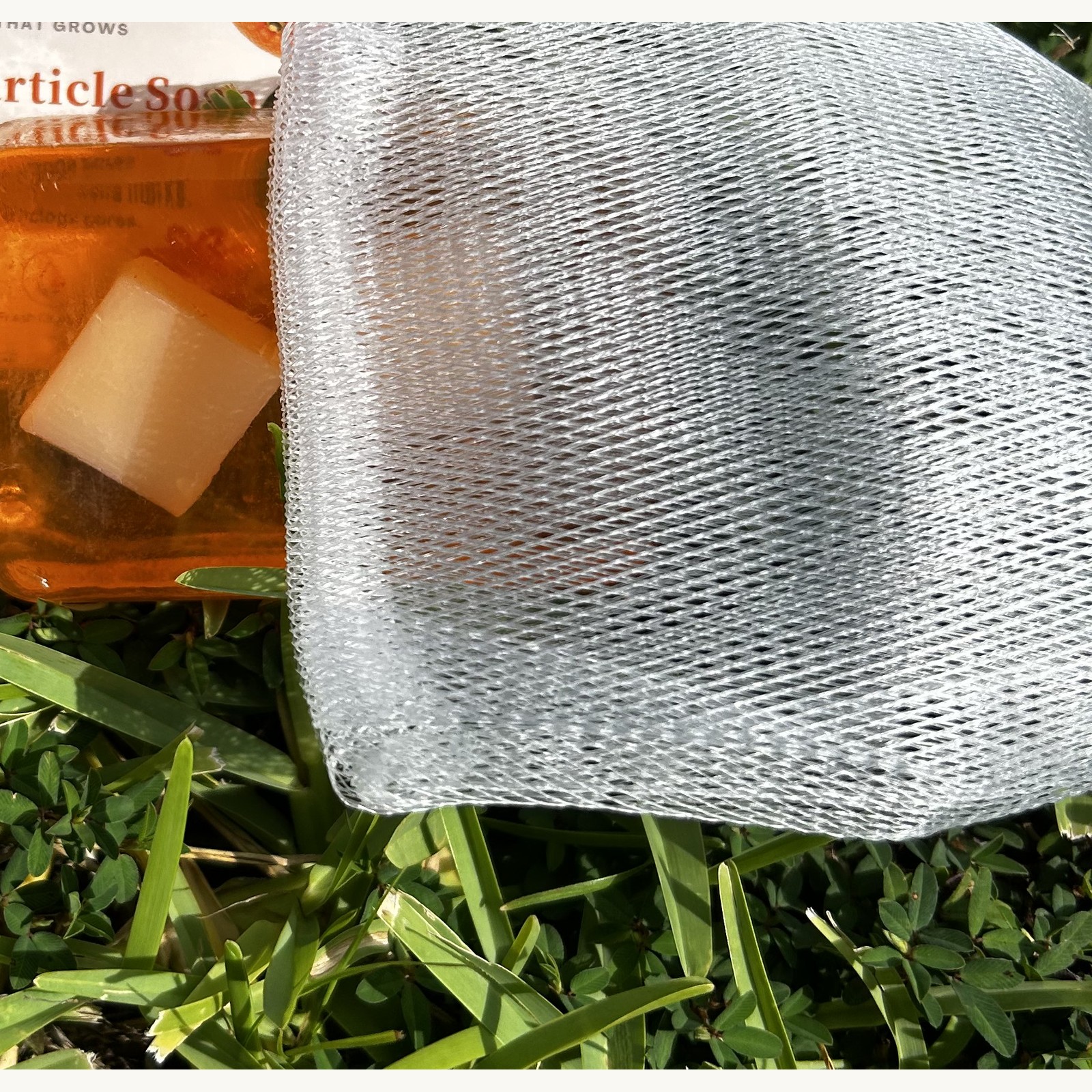 VitalLeaves Citrus Glow orange cleansing bar with foaming net